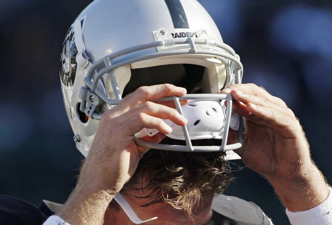 OAKLAND, CA - OCTOBER 23: Quarterback Carson Palmer #3 of the Oakland Raiders pulls his helmet off as he heads to the bench during a game against the Kansas City Chiefs on October 23, 2011 at O.co Coliseum in Oakland, California. The Chiefs won 28-0. (Photo by Brian Bahr/Getty Images)