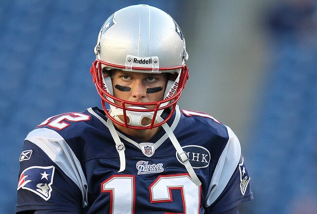 FOXBORO, MA - NOVEMBER 6:    Tom Brady #12 of the New England Patriots prepares for drills before a game with the New York Giants at Gillette Stadium on November 6, 2011 in Foxboro, Massachusetts. (Photo by Jim Rogash/Getty Images)