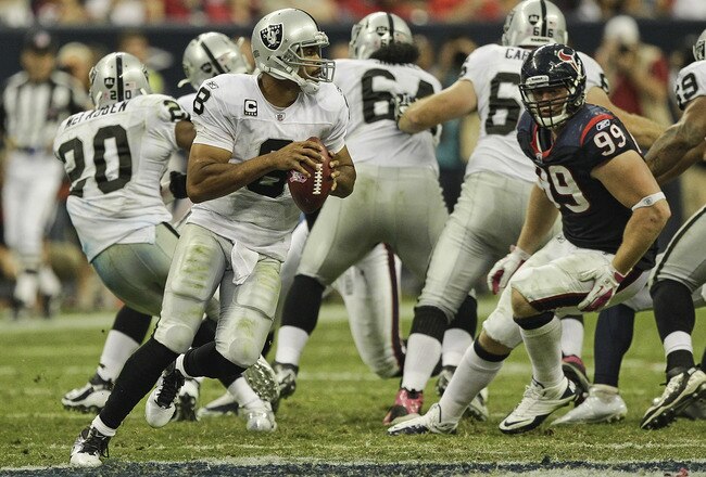 HOUSTON - OCTOBER 09: Quarterback Jason Campbell #8 of the Oakland Raiders during action against the Houston Texans at Reliant Stadium on October 9, 2011 in Houston, Texas. (Photo by Bob Levey/Getty Images)