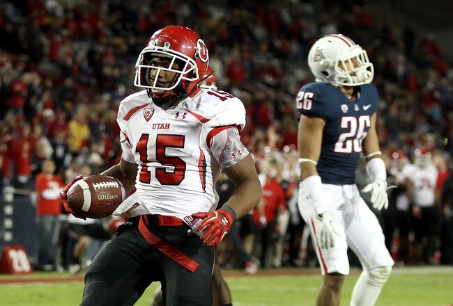 TUCSON, AZ - NOVEMBER 05:  Runningback John White IV #15 of the Utah Utes scores a 11 yard rushing touchdown against the Arizona Wildcats during the college football game at Arizona Stadium on November 5, 2011 in Tucson, Arizona.  The Utes defeated the Wildcats 34-21.  (Photo by Christian Petersen/Getty Images)