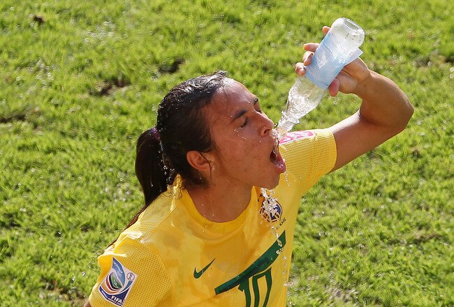 DRESDEN, GERMANY - JULY 10:  Marta of Brazil cools herself down with water during the Women's World Cup Quarter Final match between Brazil and USA at Rudolf-Harbig Stadium on July 10, 2011 in Dresden, Germany.  (Photo by Scott Heavey/Getty Images)