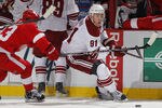 DETROIT, MI - APRIL 16:  Kyle Turris #91 of the Phoenix Coyotes tries to get around Pavel Datsyuk #13 of the Detroit Red Wings in Game Two of the Western Conference Quarterfinals during the 2011 Stanley Cup Playoffs at Joe Louis Arena on April 16, 2011 in Detroit, Michigan.  (Photo by Gregory Shamus/Getty Images)