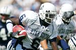 PROVO, UT - SEPTEMBER 23:  Kevin Robinson #6 of the Utah State Aggies runs with the ball against the Brigham Young Cougars on September 23, 2006 at La Vell Edwards Stadium in Provo, Utah.  (Photo By Kent Horner/Getty Images)