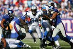 EAST RUTHERFORD, NJ - OCTOBER 17: Kevin Smith #34 of the Detroit Lions runs the ball against the New York Giants at New Meadowlands Stadium on October 17, 2010 in East Rutherford, New Jersey. The Giants defeated the Lions 28 - 20. (Photo by Andrew Burton/Getty Images)