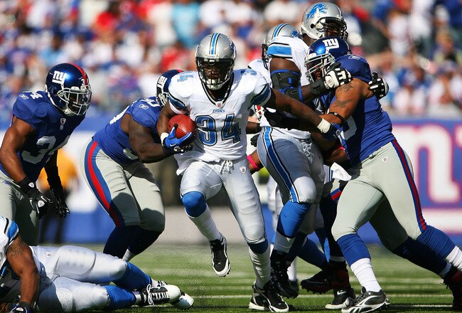 EAST RUTHERFORD, NJ - OCTOBER 17: Kevin Smith #34 of the Detroit Lions runs the ball against the New York Giants at New Meadowlands Stadium on October 17, 2010 in East Rutherford, New Jersey. The Giants defeated the Lions 28 - 20. (Photo by Andrew Burton/Getty Images)