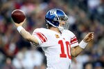 FOXBORO, MA - NOVEMBER 06:  Eli Manning #10 of the New York Giants throws the ball during the first quarter against the New England Patriots at Gillette Stadium on November 6, 2011 in Foxboro, Massachusetts.  (Photo by Elsa/Getty Images)