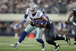 ARLINGTON, TX - NOVEMBER 06:  Jason Witten #82 of the Dallas Cowboys is brought down by David Hawthorne #57 of the Seattle Seahawks after a reception in the first half at Cowboys Stadium on November 6, 2011 in Arlington, Texas. The Cowboys defeated the Seahawks 23-13.  (Photo by Jeff Gross/Getty Images)