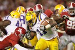 TUSCALOOSA, AL - NOVEMBER 05:  Spencer Ware #11 of the LSU Tigers gets past Dee Milliner #28 of the Alabama Crimson Tide during the game at Bryant-Denny Stadium on November 5, 2011 in Tuscaloosa, Alabama.  (Photo by Kevin C. Cox/Getty Images)