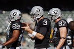 OAKLAND, CA - OCTOBER 23: Quarterback Carson Palmer #3 of the Oakland Raiders makes his way to the huddle before a game against the Kansas City Chiefs on October 23, 2011 at O.co Coliseum in Oakland, California. The Chiefs won 28-0. (Photo by Brian Bahr/Getty Images)