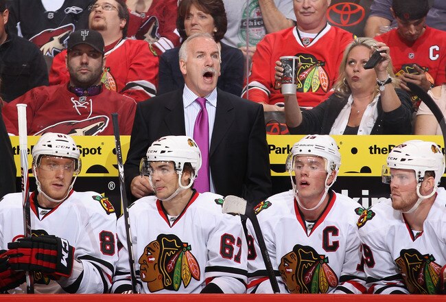 GLENDALE, AZ - OCTOBER 18:  Head coach Joel Quenneville of the Chicago Blackhawks reacts on the bench during the NHL game against the Phoenix Coyotes at Jobing.com Arena on October 18, 2011 in Glendale, Arizona. The Blackhawks defeated the Coyotes 5-2.  (Photo by Christian Petersen/Getty Images)