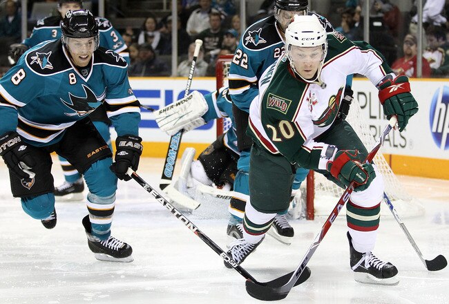 SAN JOSE, CA - JANUARY 22:  Antti Miettinen #20 of the Minnesota Wild and Joe Pavelski #8 of the San Jose Sharks at HP Pavilion on January 22, 2011 in San Jose, California.  (Photo by Ezra Shaw/Getty Images)