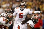 NEW ORLEANS, LA - NOVEMBER 06:   Josh Freeman #5 of the Tampa Bay Buccaneers calls a play during their game against the New Orleans Saints at Mercedes-Benz Superdome on November 6, 2011 in New Orleans, Louisiana.  (Photo by Streeter Lecka/Getty Images)