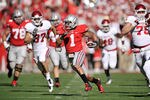 COLUMBUS, OH - NOVEMBER 5:  Dan Herron #1 of the Ohio State Buckeyes breaks free for a 48-yard run in the first half against the Indiana Hoosiers to set up a field goal at Ohio Stadium on November 5, 2011 in Columbus, Ohio.  (Photo by Jamie Sabau/Getty Images)