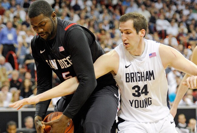LAS VEGAS, NV - MARCH 12:  Brian Carlwell #5 of the San Diego State Aztecs gets a rebound away from Noah Hartsock #34 of the Brigham Young University Cougars during the championship game of the Conoco Mountain West Conference Basketball tournament at the Thomas & Mack Center March 12, 2011 in Las Vegas, Nevada. San Diego State won 72-54.  (Photo by Ethan Miller/Getty Images)