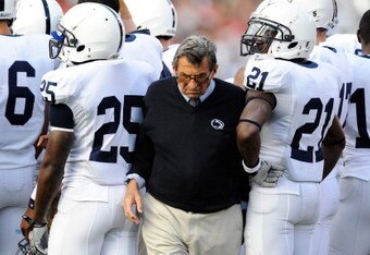 COLUMBUS, OH - NOVEMBER 13:  Head Coach Joe Paterno of the Penn State Nittany Lions pushes his way through a group of his players during a timeout in a game against the Ohio State Buckeyes at Ohio Stadium on November 13, 2010 in Columbus, Ohio.  (Photo by Jamie Sabau/Getty Images)