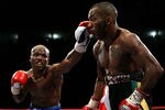 NOTTINGHAM, ENGLAND - MAY 10:  Timothy Bradley connects with a left jab on Junior Witter down during their WBC Light Welterweight fight on May 10, 2008 at Nottingham Ice Arena in Nottingham, England. (Photo by John Gichigi/Getty Images)