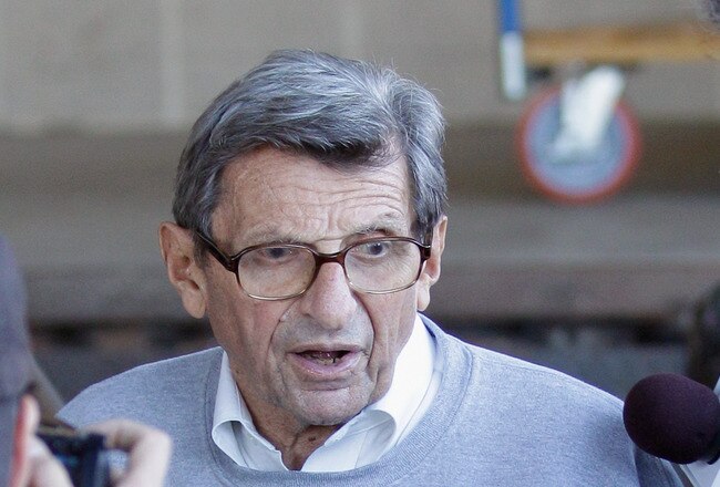 UNIVERSITY PARK, PA - NOVEMBER 08:  Penn State University head football coach Joe Paterno is surrounded by the media while leaving the team's football building on November 8, 2011 in University Park, Pennsylvania. Amid allegations that former assistant Jerry Sandusky was involved with child sex abuse, Paterno's weekly news conference was canceled about an hour before it was scheduled to occur. (Photo by Rob Carr/Getty Images)