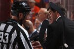 PHILADELPHIA, PA - APRIL 26:  Head coach Peter Laviolette of the Philadelphia Flyers talks to linesman Brian Murphy #93 in Game Seven of the Eastern Conference Quarterfinals against the Buffalo Sabres during the 2011 NHL Stanley Cup Playoffs at Wells Fargo Center on April 26, 2011 in Philadelphia, Pennsylvania.  (Photo by Bruce Bennett/Getty Images)