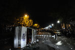 STATE COLLEGE, PA - NOVEMBER 10: A news van is flipped over as students and those in the community fill the streets and react after football head coach Joe Paterno was fired during the Penn State Board of Trustees Press Conference, in downtown Penn State, in the early morning hours of November 10, 2011 in State College, Pennsylvania. Paterno and Spanier have lost their positions amid allegations that former former Penn State defensive coordinator Jerry Sandusky was involved with child sex abuse.  (Photo by Patrick Smith/Getty Images)