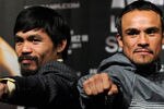 LAS VEGAS, NV - NOVEMBER 09:  Boxers Manny Pacquiao (L) and Juan Manuel Marquez pose during the final news conference for their bout at the MGM Grand Hotel/Casino November 9, 2011 in Las Vegas, Nevada. Pacquiao will defend his WBO welterweight title against Marquez when the two meet in the ring for the third time on November 12 in Las Vegas.  (Photo by Ethan Miller/Getty Images)