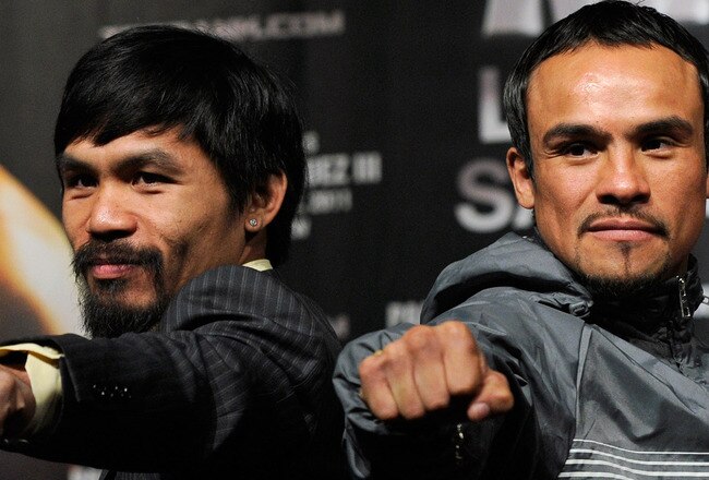 LAS VEGAS, NV - NOVEMBER 09:  Boxers Manny Pacquiao (L) and Juan Manuel Marquez pose during the final news conference for their bout at the MGM Grand Hotel/Casino November 9, 2011 in Las Vegas, Nevada. Pacquiao will defend his WBO welterweight title against Marquez when the two meet in the ring for the third time on November 12 in Las Vegas.  (Photo by Ethan Miller/Getty Images)