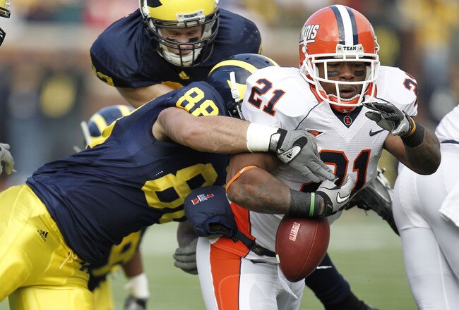 ANN ARBOR, MI - NOVEMBER 06:  Jason Ford #21 of the Illinois Fighting Illini fumbles while being tackled by Craig Roh #88 of the Michigan Wolverines at Michigan Stadium on November 6, 2010 in Ann Arbor, Michigan.  (Photo by Gregory Shamus/Getty Images)