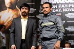 LAS VEGAS, NV - NOVEMBER 09:  Boxers Manny Pacquiao (L) and Juan Manuel Marquez pose during the final news conference for their bout at the MGM Grand Hotel/Casino November 9, 2011 in Las Vegas, Nevada. Pacquiao will defend his WBO welterweight title against Marquez when the two meet in the ring for the third time on November 12 in Las Vegas.  (Photo by Ethan Miller/Getty Images)