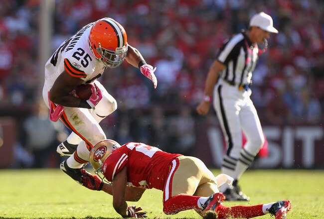 SAN FRANCISCO, CA - OCTOBER  Carlos Rogers #22 of the San Francisco 49ers tackles Chris Ogbonnaya #25 of the Cleveland Browns at Candlestick Park on October 30, 2011 in San Francisco, California.  (Photo by Ezra Shaw/Getty Images)