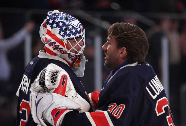 NEW YORK, NY - NOVEMBER 06: Henrik Lundqvist #30 (R) congratulates Martin Biron #43 (L) of the New York Rangers on his 3-0 shutout against the Winnipeg Jets at Madison Square Garden on November 6, 2011 in New York City. (Photo by Bruce Bennett/Getty Images)