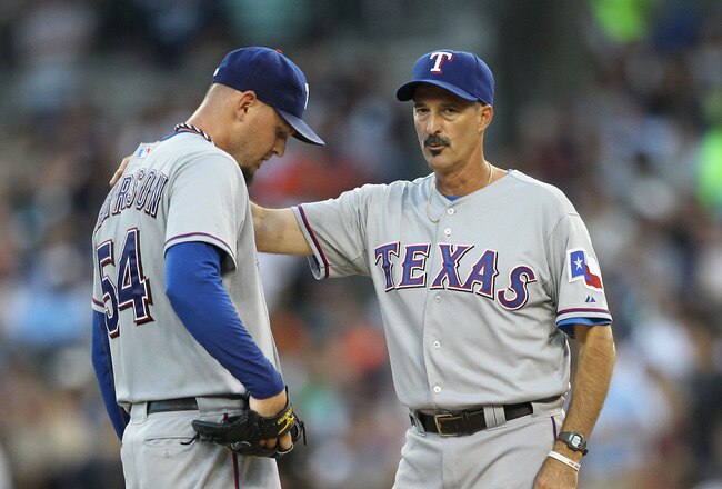 DETROIT, MI - AUGUST 03: Texas Rangers pitching coach Mike Maddux #31 talks with Matt Harrison #54 in the fourth inning of the game against the Detroit Tigers at Comerica Park on August 3, 2011 in Detroit, Michigan. The Tigers defeated the Rangers 5-4. (Photo by Leon Halip/Getty Images)