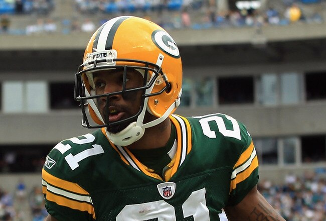 CHARLOTTE, NC - SEPTEMBER 18:   Charles Woodson #21 of the Green Bay Packers celebrates after recovering a fumble against the Carolina Panthers during their game at Bank of America Stadium on September 18, 2011 in Charlotte, North Carolina.  (Photo by Streeter Lecka/Getty Images)