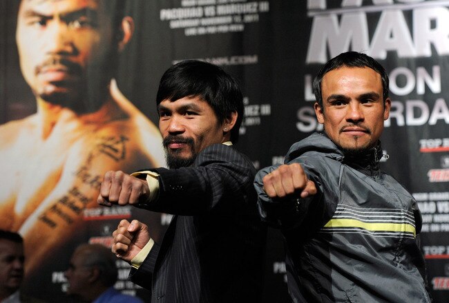 LAS VEGAS, NV - NOVEMBER 09:  Boxers Manny Pacquiao (L) and Juan Manuel Marquez pose during the final news conference for their bout at the MGM Grand Hotel/Casino November 9, 2011 in Las Vegas, Nevada. Pacquiao will defend his WBO welterweight title against Marquez when the two meet in the ring for the third time on November 12 in Las Vegas.  (Photo by Ethan Miller/Getty Images)