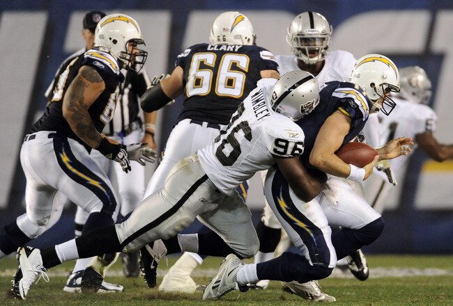 SAN DIEGO, CA - NOVEMBER 10: Defensive lineman  Kamerion Wimbley #96 of the Oakland Raiders sacks quarterback  Philip Rivers #17 of the San Diego Chargers in the first half at Qualcomm Stadium on November 10, 2011 in San Diego, California.  (Photo by Harry How/Getty Images)