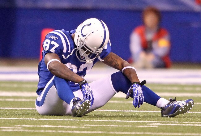 INDIANAPOLIS - NOVEMBER 28:  Reggie Wayne #87 of the Indianapolis Colts sits on the field after dropping a pass during the NFL game against the San Diego Chargers at Lucas Oil Stadium on November 28, 2010 in Indianapolis, Indiana. The chargers won 36-14. (Photo by Andy Lyons/Getty Images)