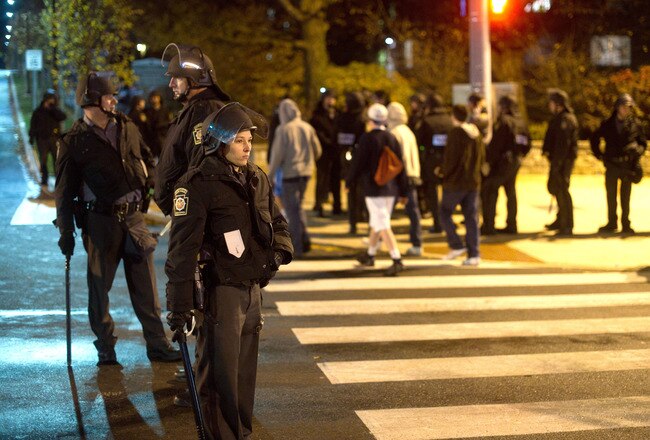 STATE COLLEGE, PA -NOVEMBER 10: Pennsylvania State Police in riot gear line East College Avenue in the early morning hours on November 10, 2011 in State College, Pennsylvania. Police patrolled the streets following a riot on the Pennsylvania State Unitversity campus in response to the firing of Head Football Coach Joe Paterno in the wake of the Jerry Sandusky scandal that has rocked the university's administration and athletic program.  14,000 students took to the streets to express their feelings about the handling of the situation. (Photo by Jeff Swensen/Getty Images)