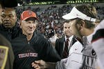 NORMAN, OK - OCTOBER 22:  Texas Tech Head Coach Tommy Tuberville and the Oklahoma Sooners Head Coach Bob Stoops meet after the game October 22, 2011 at Gaylord Family-Oklahoma Memorial Stadium in Norman, Oklahoma. Texas Tech upset Oklahoma 41-38. (Photo by Brett Deering/Getty Images)