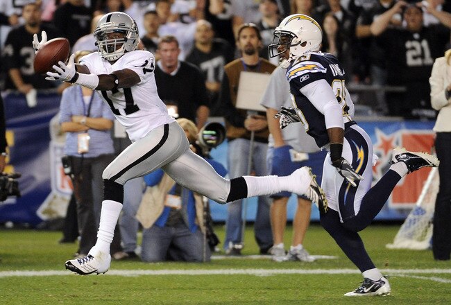 SAN DIEGO, CA - NOVEMBER 10:   Denarius Moore #17 of the Oakland Raiders makes a catch for 47 yards in front of Quentin Jammer #23 of the San Diego Chargers at Qualcomm Stadium on November 10, 2011 in San Diego, California.  (Photo by Harry How/Getty Images)