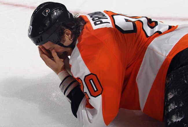 PHILADELPHIA, PA - OCTOBER 24: Chris Pronger #20 of the Philadelphia Flyers falls to the ice after being hit in the face by a stick during the game against the Toronto Maple Leafs at Wells Fargo Center on October 24, 2011 in Philadelphia, Pennsylvania.  (Photo by Bruce Bennett/Getty Images)