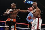 LAS VEGAS, NV - NOVEMBER 12:  (L-R) Timothy Bradley connects with a left to the head of Joel Casamayor during their WBO junior welterweight title fight at the MGM Grand Garden Arena on November 12, 2011 in Las Vegas, Nevada.  (Photo by Harry How/Getty Images)