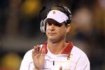 SAN FRANCISCO, CA - OCTOBER 13:  USC Trojans head coach Lane Kiffin cheers on his team during their game against the California Golden Bears at AT&T Park on October 13, 2011 in San Francisco, California.  (Photo by Ezra Shaw/Getty Images)