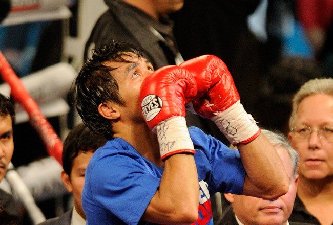 LAS VEGAS, NV - NOVEMBER 12:  Manny Pacquiao celebrates his majority decision victory against Juan Manuel Marquez in the WBO world welterweight title fight at the MGM Grand Garden Arena on November 12, 2011 in Las Vegas, Nevada.  (Photo by Ethan Miller/Getty Images)