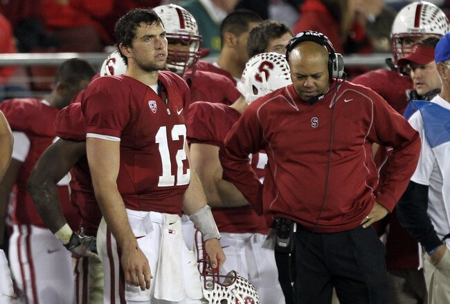 STANFORD, CA - NOVEMBER 12:  Andrew Luck #12 of the Stanford Cardinal and head coach David Shaw stand on the sideline during the closing minute of their loss to the Oregon Ducks at Stanford Stadium on November 12, 2011 in Stanford, California.  (Photo by Ezra Shaw/Getty Images)