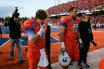 BOISE, ID - NOVEMBER 12:  Kellen Moore #11 and Tyrone Crawford #40 of the Boise State Broncos leave after the loss to the TCU Horned Frogs  at Bronco Stadium on November 12, 2011 in Boise, Idaho.  (Photo by Otto Kitsinger III/Getty Images)