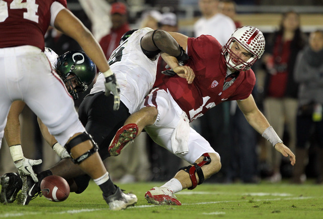 STANFORD, CA - NOVEMBER 12:  Andrew Luck #12 of the Stanford Cardinal fumbles the ball after being sacked by Terrell Turner #45 of the Oregon Ducks at Stanford Stadium on November 12, 2011 in Stanford, California.  (Photo by Ezra Shaw/Getty Images)