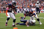 2DENVER, CO - OCTOBER 09:  Knowshon Moreno #27 of the Denver Broncos runs in for a touchdown after catching the pass from quarterback Tim Tebow #15 against the San Diego Chargers at Sports Authority Field at Mile High on October 9, 2011 in Denver, Colorado.  (Photo by Doug Pensinger/Getty Images)
