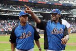 NEW YORK, NY - SEPTEMBER 28:  Jose Reyes #7 (R) of the New York Mets walks off the field with bullpen pitcher Liliano Castro after the game against the Cincinnati Reds at Citi Field on September 28, 2011 in the Flushing neighborhood of the Queens borough of New York City. The Mets defeated the Reds 3-0. Reyes is an unrestricted free agent at the end of the season. Reyes also ended the game with a narrow lead for the National League batting title.  (Photo by Jim McIsaac/Getty Images)