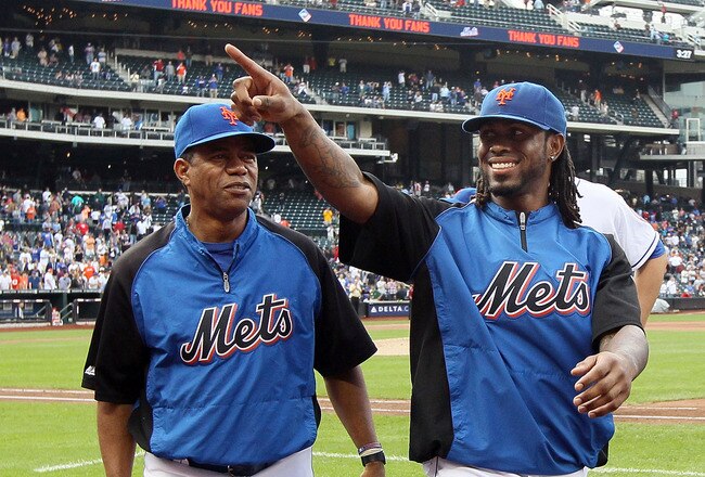 NEW YORK, NY - SEPTEMBER 28:  Jose Reyes #7 (R) of the New York Mets walks off the field with bullpen pitcher Liliano Castro after the game against the Cincinnati Reds at Citi Field on September 28, 2011 in the Flushing neighborhood of the Queens borough of New York City. The Mets defeated the Reds 3-0. Reyes is an unrestricted free agent at the end of the season. Reyes also ended the game with a narrow lead for the National League batting title.  (Photo by Jim McIsaac/Getty Images)