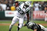 OAKLAND, CA - SEPTEMBER 25:  Shonn Greene #23 of the New York Jets runs against Chris Johnson #37 of the Oakland Raiders at O.co Coliseum on September 25, 2011 in Oakland, California.  (Photo by Jed Jacobsohn/Getty Images)
