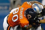 CHICAGO, IL - NOVEMBER 13: Julius Peppers #90 of the Chicago Bears sacks matthew Stafford #9 of  the Detroit Lions at Soldier Field on November 13, 2011 in Chicago, Illinois. (Photo by Scott Boehm/Getty Images)