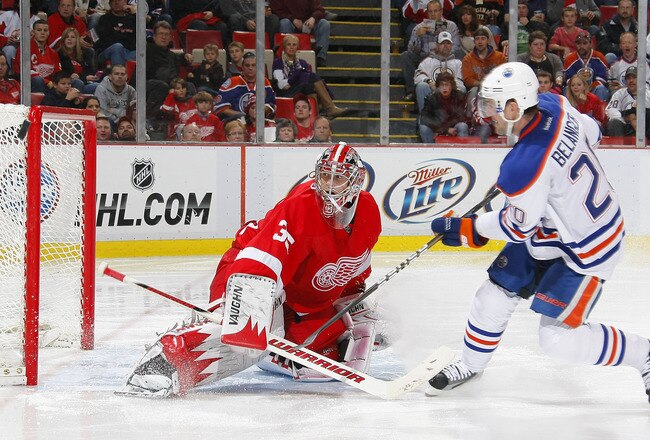DETROIT, MI - NOVEMBER 11:  Eric Belanger #20 of the Edmonton Oilers is stopped on a short breakaway by Jimmy Howard #35 of the Detroit Red Wings during their NHL game at Joe Louis Arena November 11, 2011 in Detroit, Michigan.  (Photo by Dave Sandford/Getty Images)